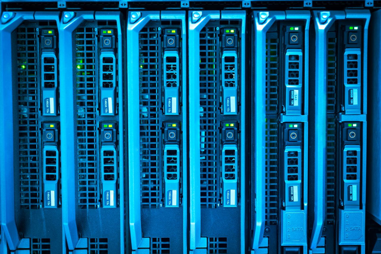 Services Detailed image of illuminated server racks showcasing modern technology infrastructure.